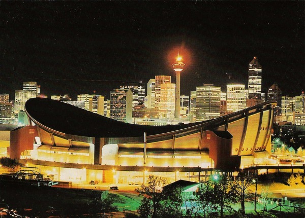 photograph of Saddledome with city at night