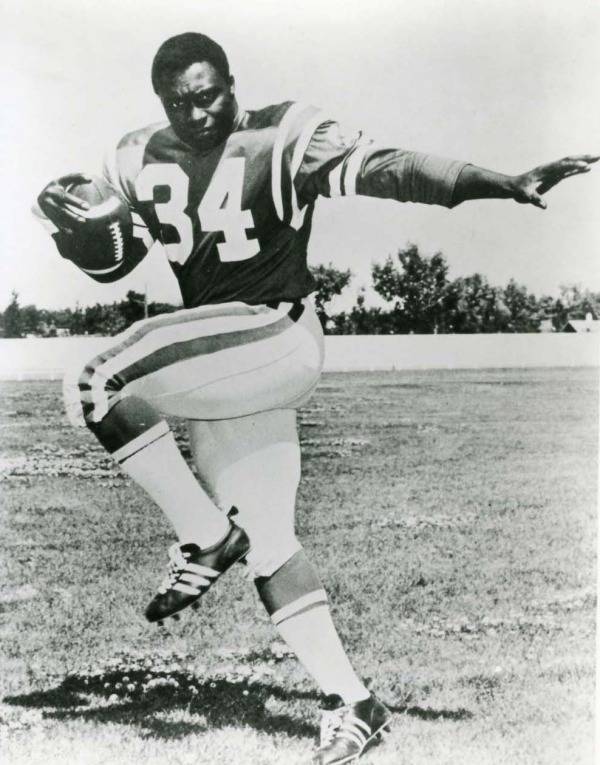 posed photograph of George Reed with football