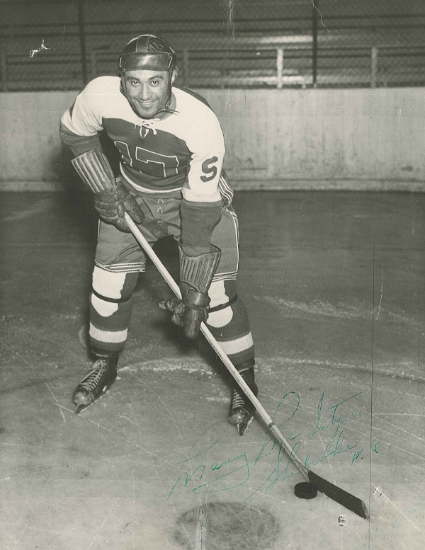 photograph of Manny McIntyre posed in hockey uniform