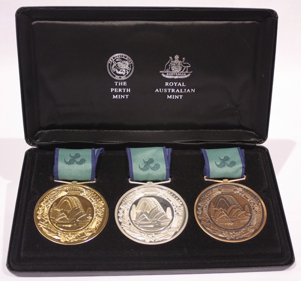 set of gold, silver and bronze Paralympic medals in case