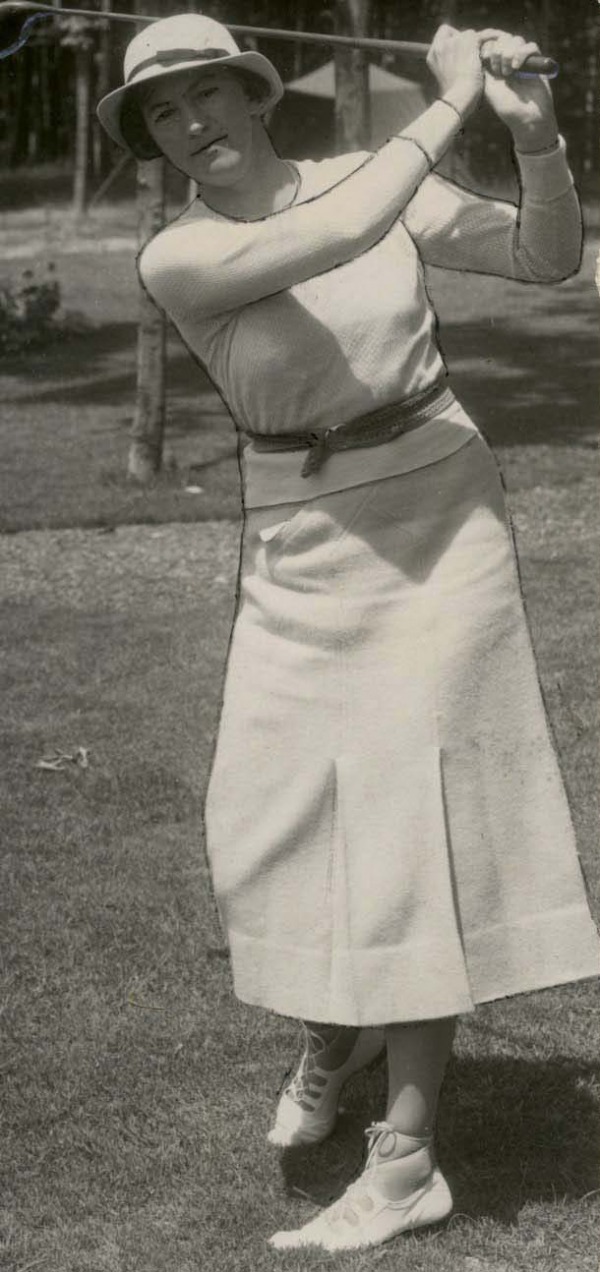 photograph of a young Ada Mackenzie swinging golf club