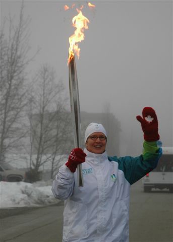 photograph of Marion Lay with Vancouver 2010 torch