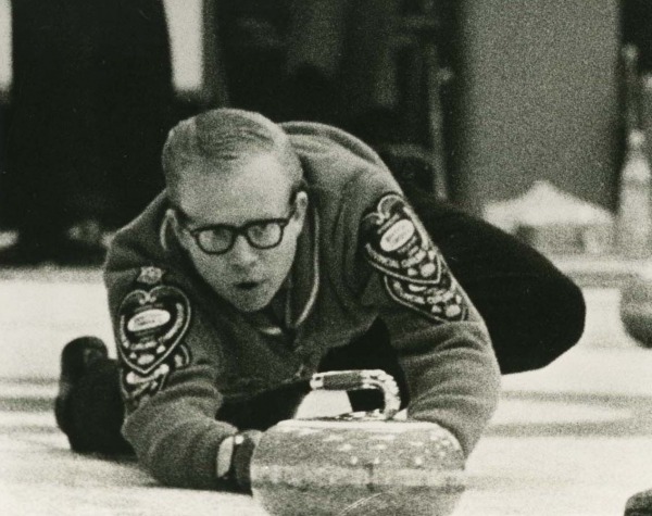 Photograph of Ron Northcott behind curling stone
