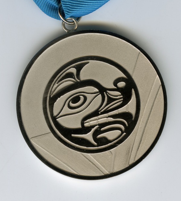 Silver medal with image of wolf head