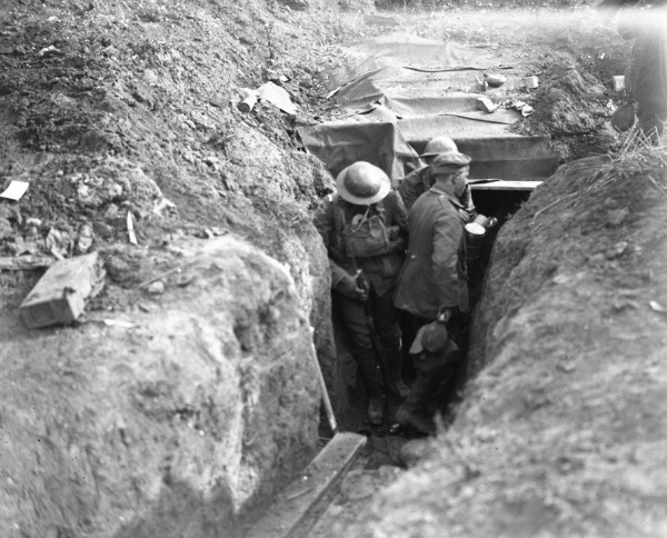 photograph of soldiers clearing dug-outs