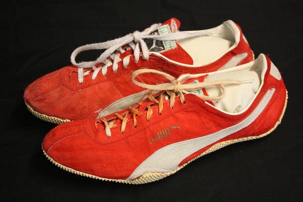 red and white track shoes