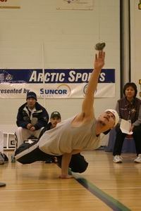 Image of an athlete doing the one-hand reach at the 2004 Arctic Winter Games