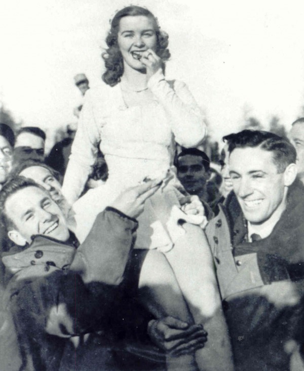 photograph of Barbara Ann Scott on shoulder of Reg Schroeter and Ab Renaud