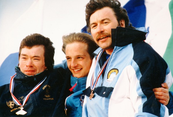 Image of three athletes with ulu medals