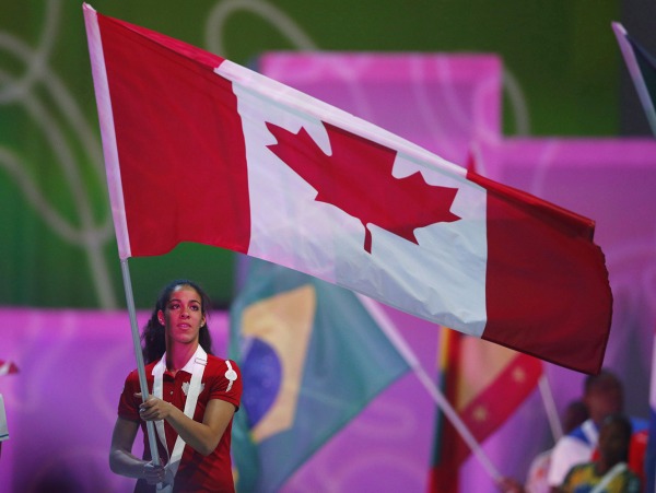 Photograph of Kia Nurse carrying the Canadian flag