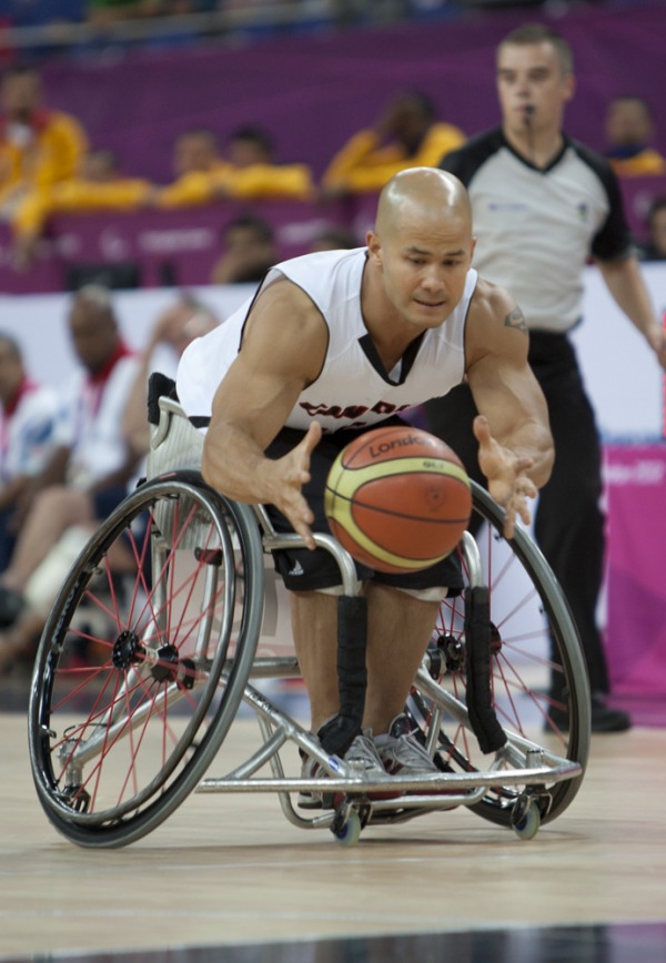 photograph of David Eng playing wheelchair basketball