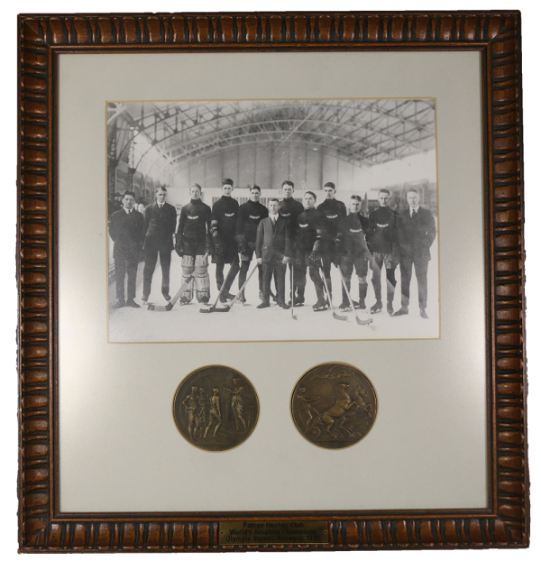 framed photograph of 1920 team and medals