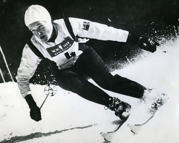 photograph of Lucile Wheeler skiing downhill wearing white helmet