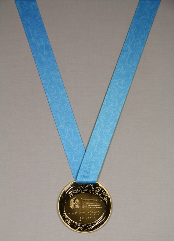 gold medal with Games logo on blue and green ribbon