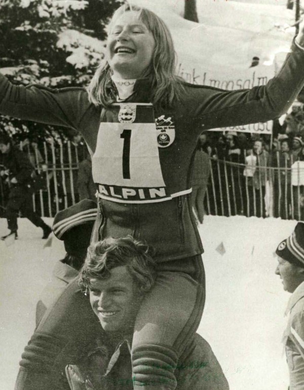 Photograph of Kathy Kreiner sitting on shoulders of team mate Jungle Jim Hunter