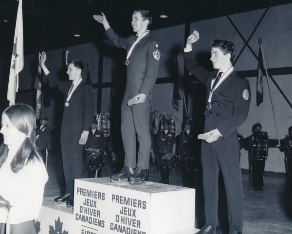 Photograph of Toller Cranston standing on podium