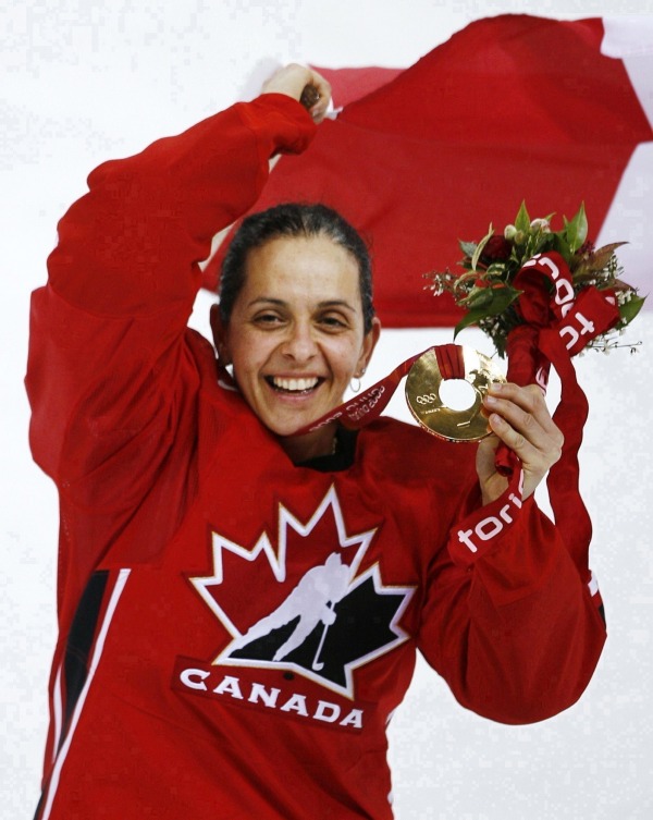 photograph of Danielle Goyette with medal Canadian flag