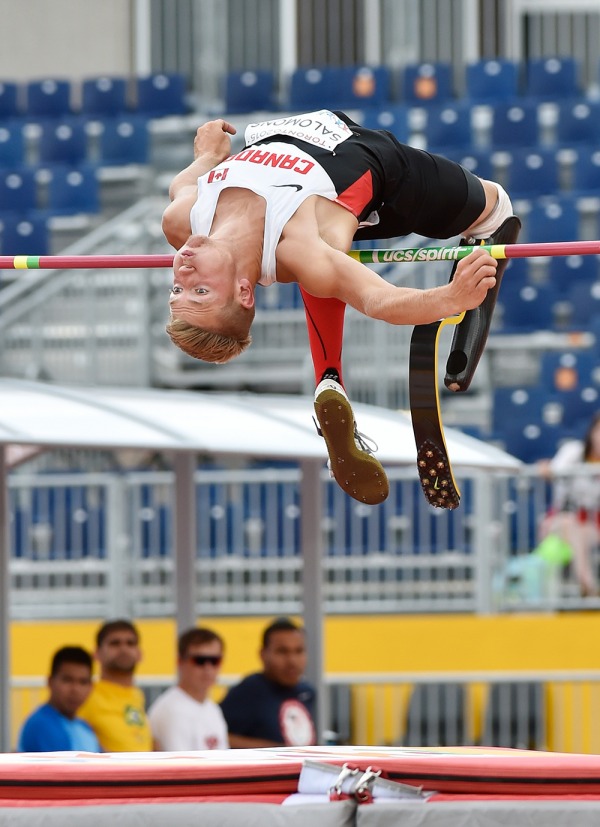 photograph of Cody Salomons jumping over high bar