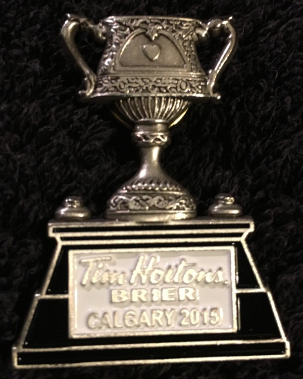 lapel pin in image of trophy with Tim Horton's Brier