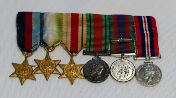 bar of six medals with ribbons
