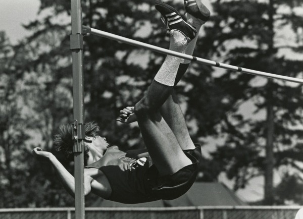 Photograph of Greg Joy jumping over high bar
