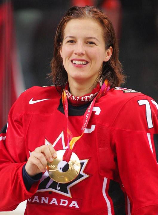 photograph of Cassie Campbell with Olympic gold medal