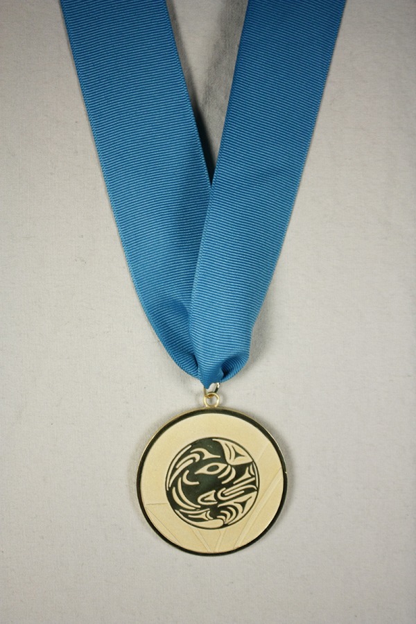 Gold medal with image of wolf