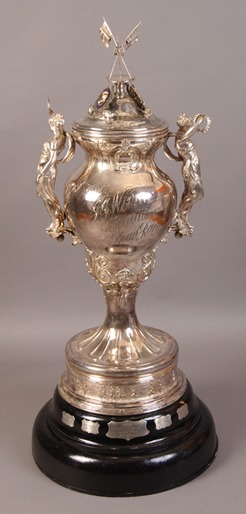 silver trophy for road race with figures on sides