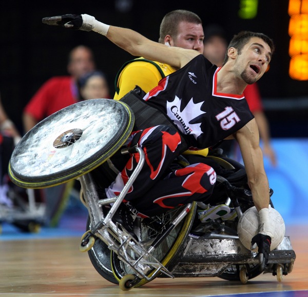 photograph of Canadian player with wheelchair tipping)
