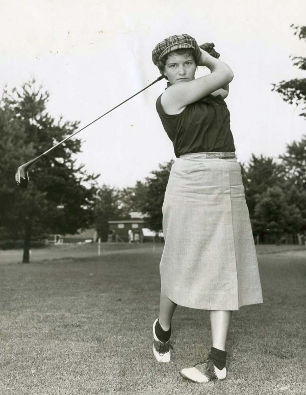 photograph of Marlene Stewart Streit swinging golf club