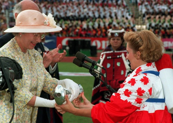 Photograph of Queen Elizabeth II accepting baton