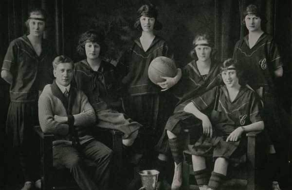 photograph of team of six women and Percy Page