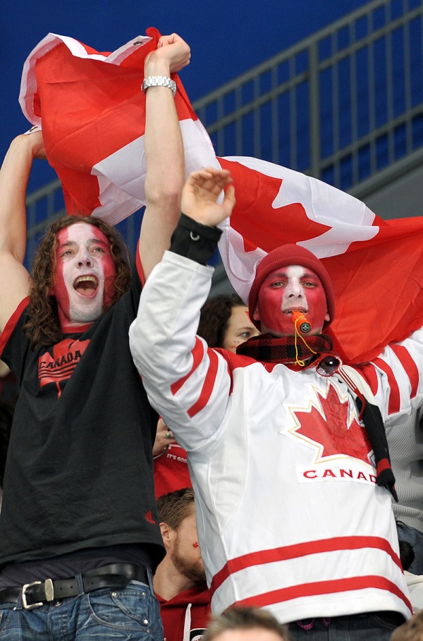 photograph of fans with red and white painted faces