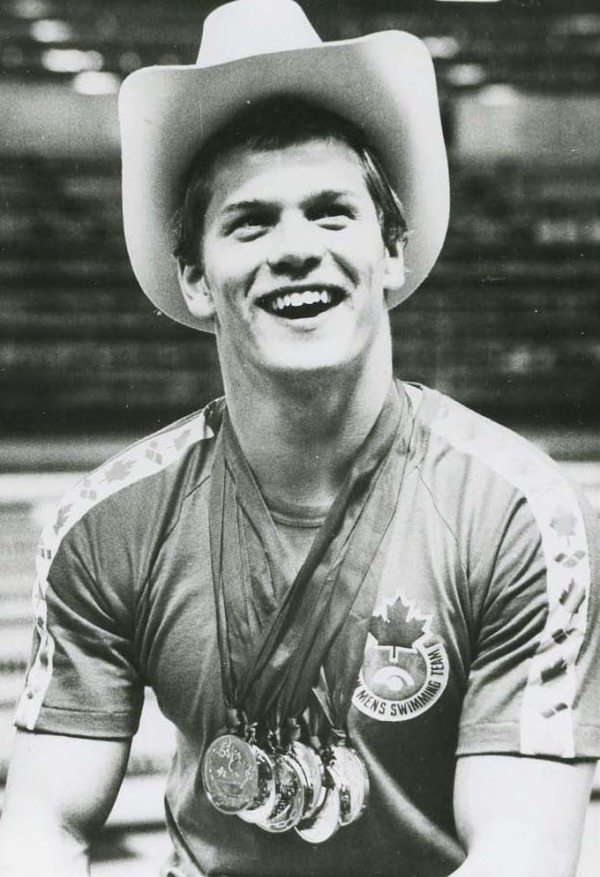 Photograph of Graham Smith with medals and wearing a cowboy hat