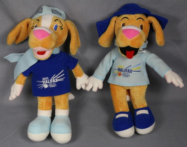 Toy dogs wearing hats and sweaters with logo