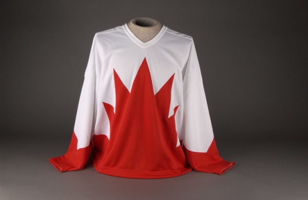 white hockey jersey with red maple leaf
