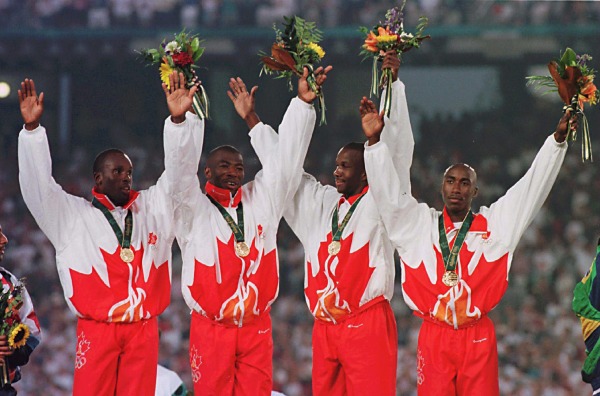 photograph of the 1996 men's relay team with medals