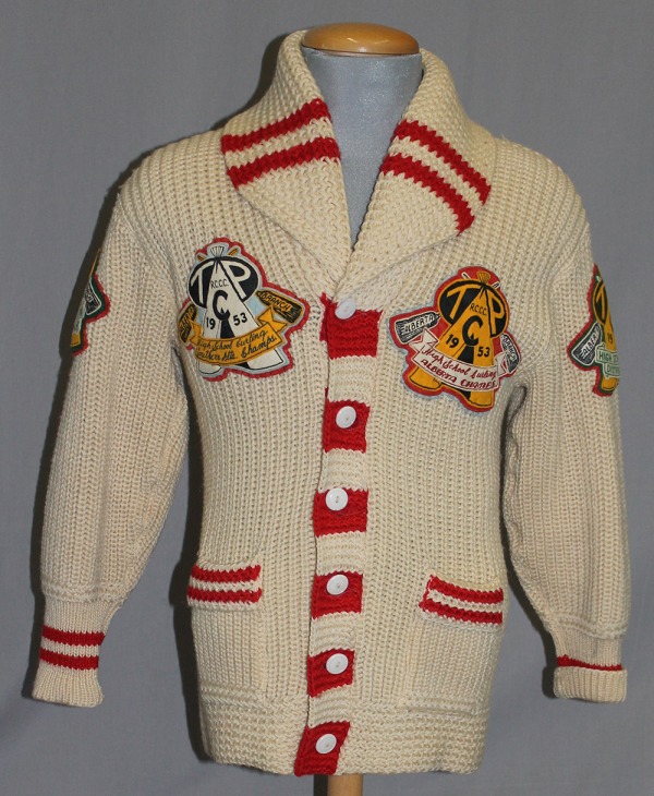white knitted sweater with team crests