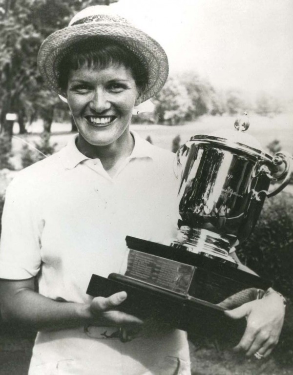 photograph of Marlene Steward Streit holding Duchess of Connaught trophy