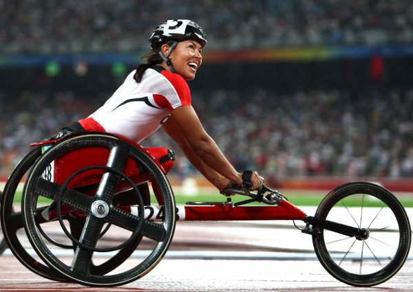 photograph of Chantal Petitclerc in race wheelchair