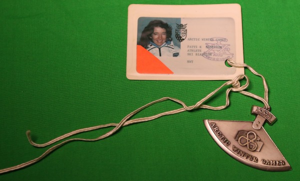Image of accreditation and silver ulu medal won by Patti-Kay Hamilton at the 1994 Arctic Winter Games