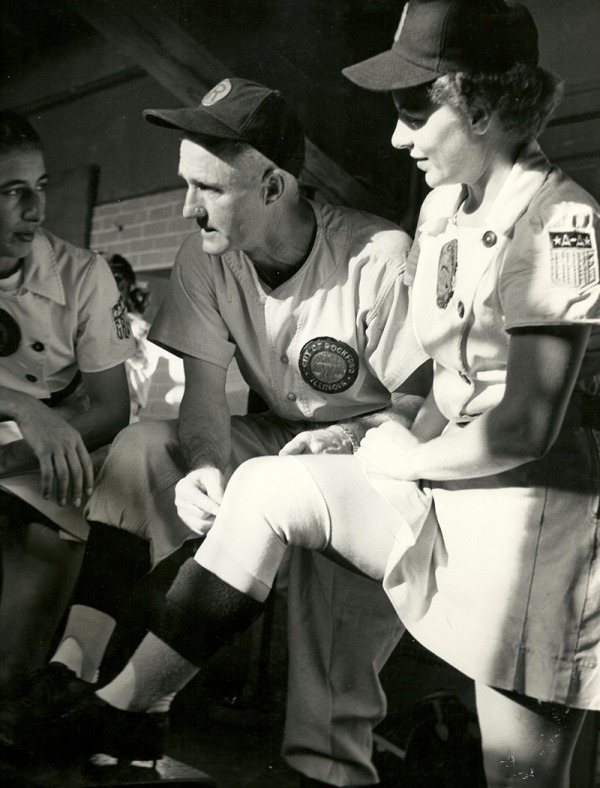 photograph of Helen Nicol Fox in dugout with coach
