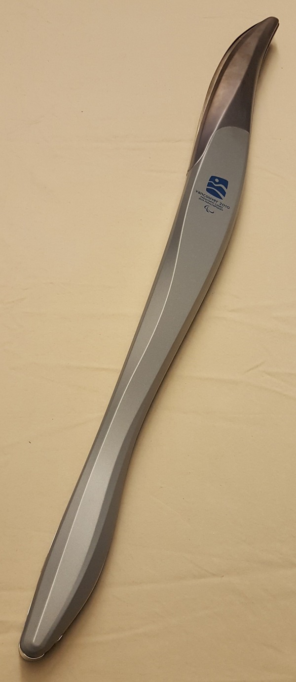steel blue curved relay torch with 2010 Paralympic Games logo
