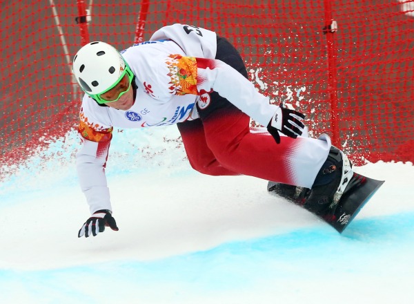 photograph of Tyler Mosher competing in snowboard run