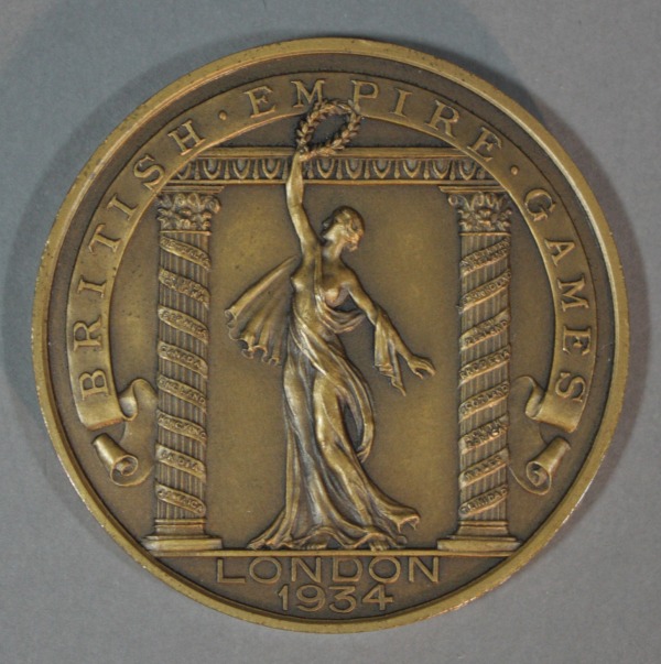 circular medal with image of Victory holding wreath