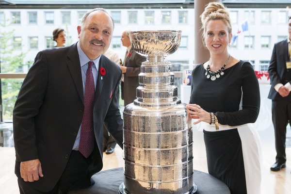 Photo of Bryan Trottier and friend beside Stanley Cup at his 2016 induction to Canada's Sports Hall of Fame
