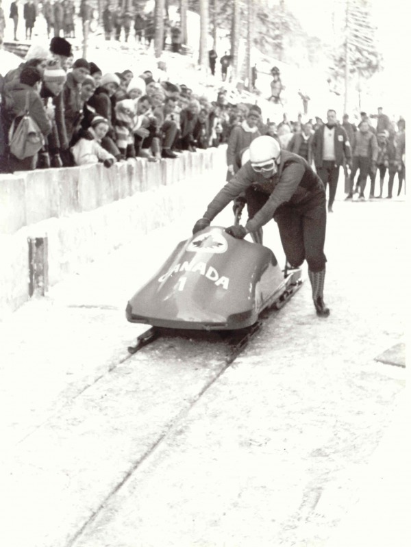 photograph of Vic Emery and Peter Kirby pushing bobsled