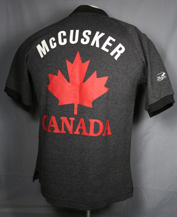 curling sweater with MCCUSKER on back