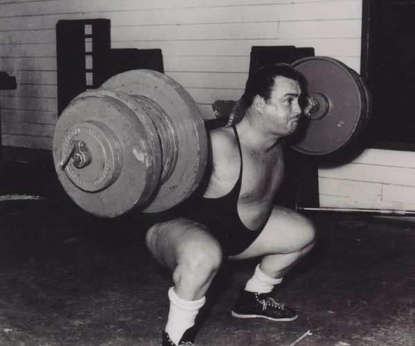 Photograph of Doug Hepburn lifting barbell on shoulders