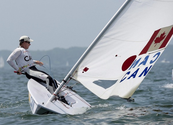 photograph of athlete sailing in laser sailboat